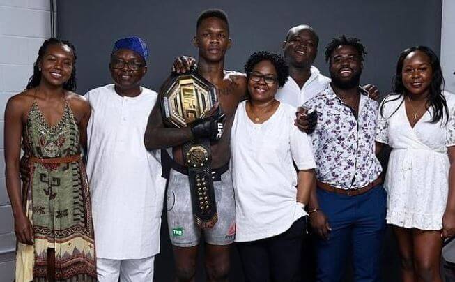 Israel Adesanya, with his parents and siblings.